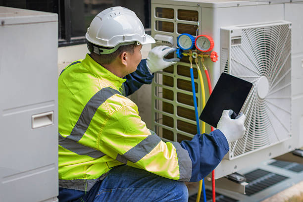 Professional Heat Pump Repair technician working in Hallsboro, NC